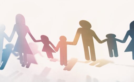 Paper doll family holding hands