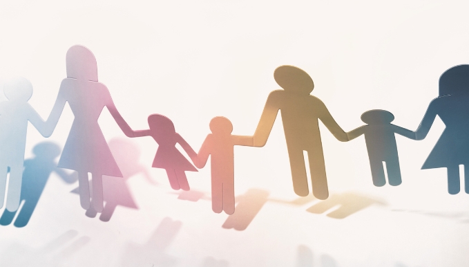 Paper doll family holding hands